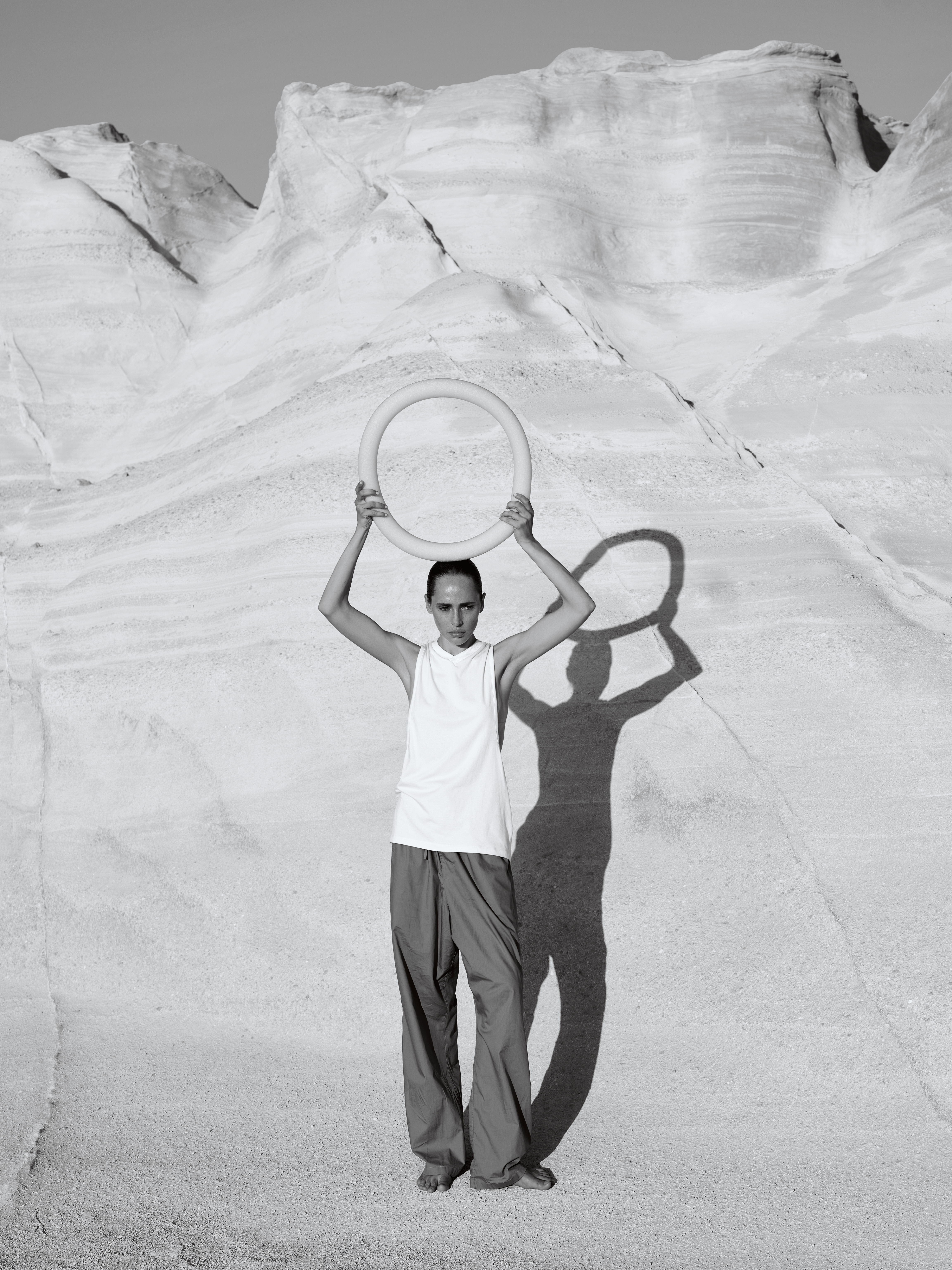 Inna holding a circular object, full-length from the new series